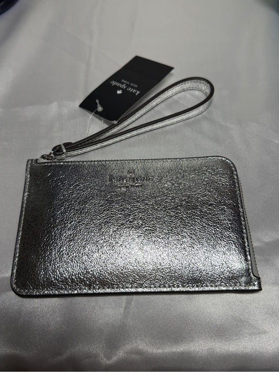 kate spade Handbags - Kate Spade Metallic Silver Wristlet NWT